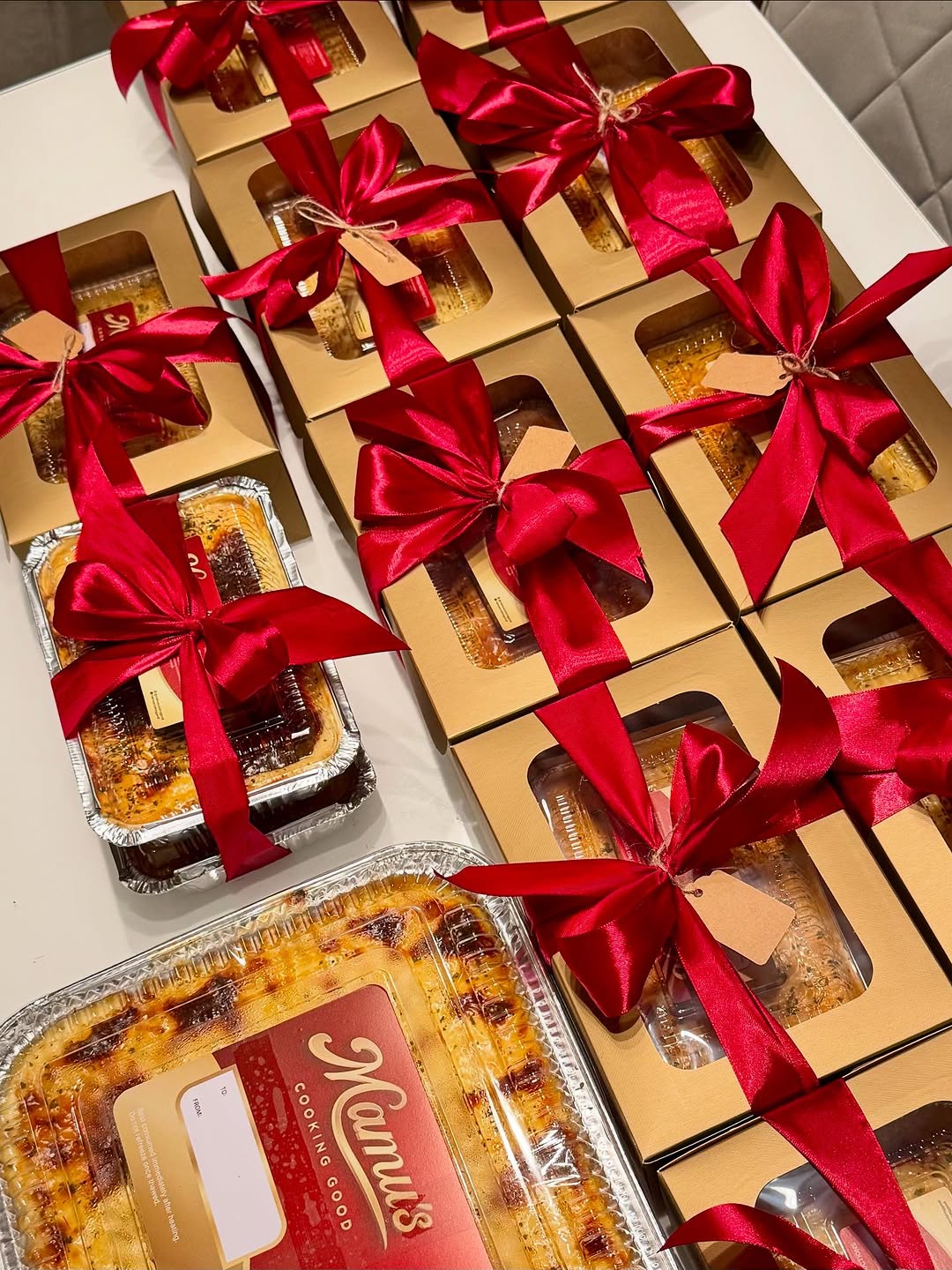 Mamu's Cooking Good gift boxes with red ribbons